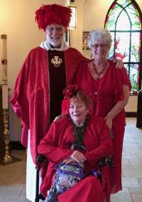 Father Mike wears Lynn's hat